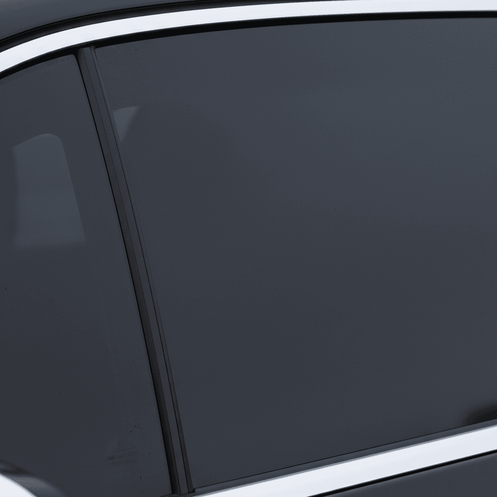 Close-up of precision window tint edge installation on rear window