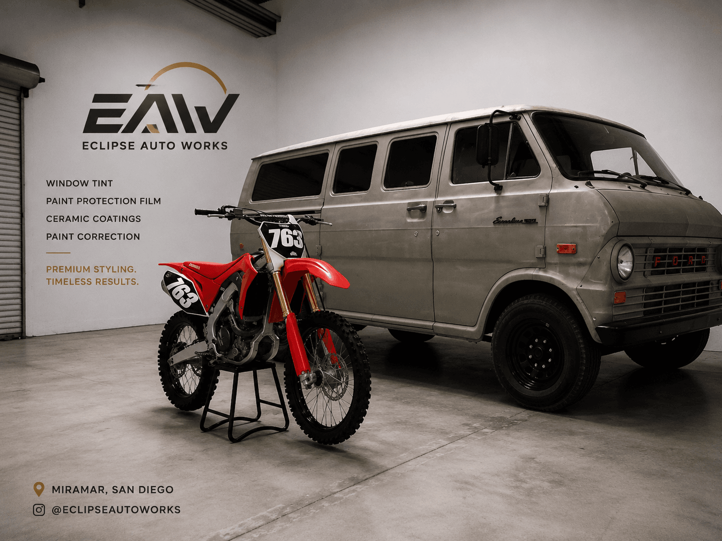 Red dirt bike and vintage Ford van inside the Eclipse Auto Works garage in Miramar.